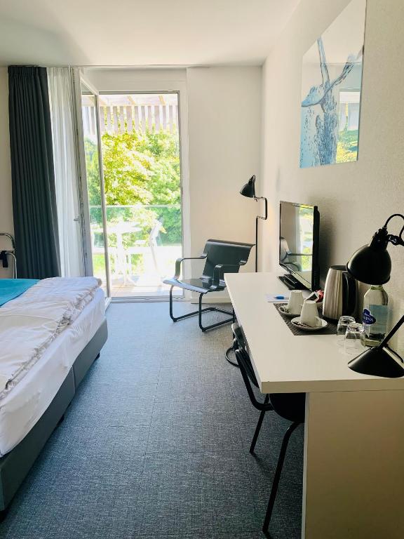 Voodi või voodid majutusasutuse Hôtel de la Source toas