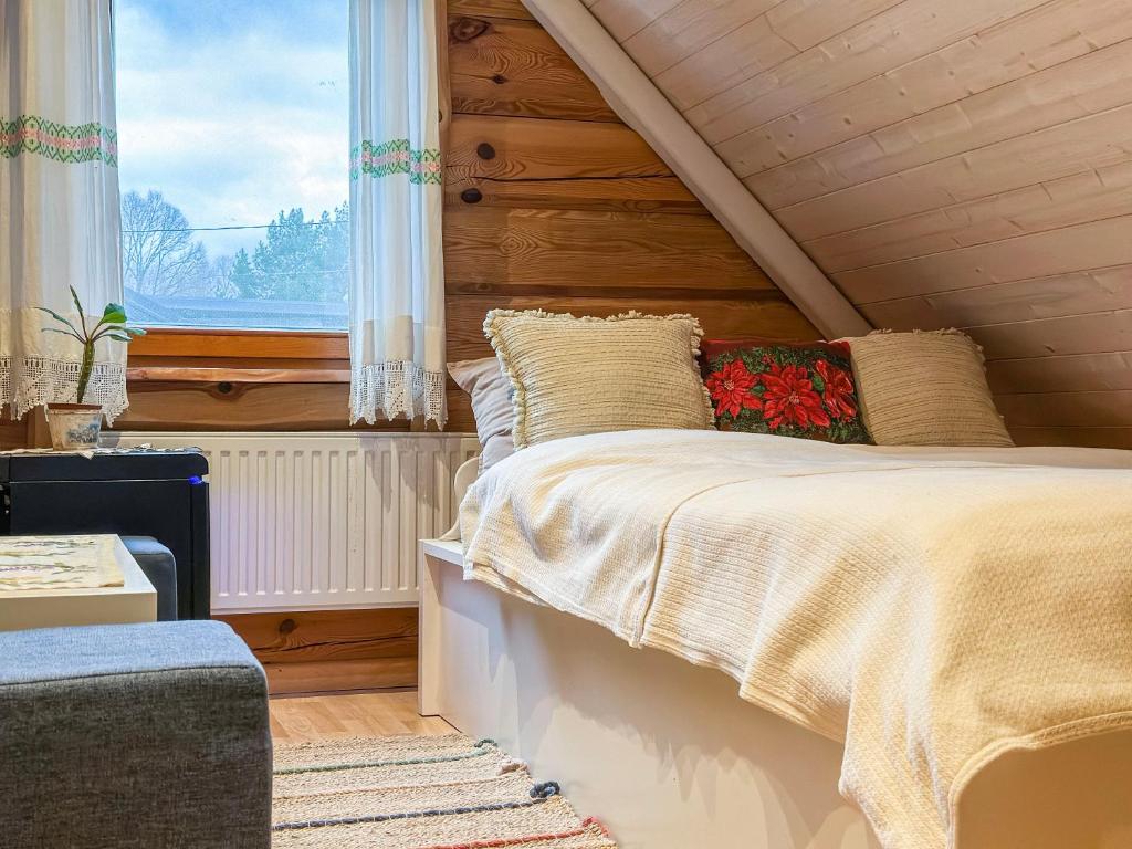 Postel nebo postele na pokoji v ubytování Pirtelė Rykštelė