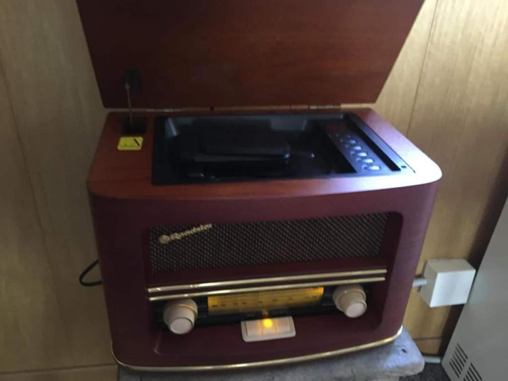 a toaster oven is sitting in a room at Vintage Apartment By Apartments Capricorn in Gsteigwiler