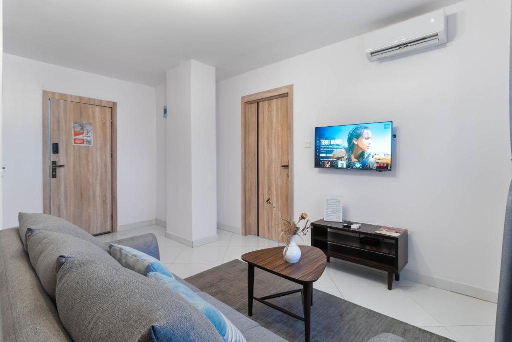 Sigma Base Apartmentsにあるテレビまたはエンターテインメントセンター