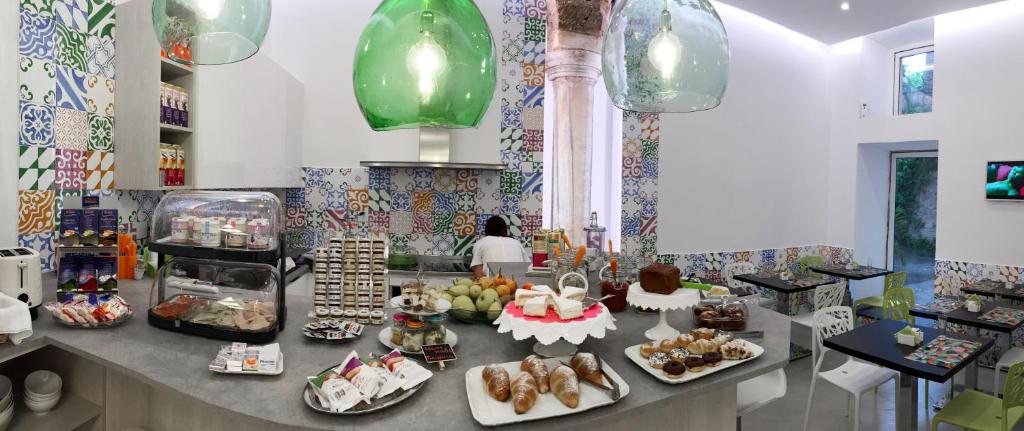 a counter with many plates of food on it at Sorrento Flats in Sorrento