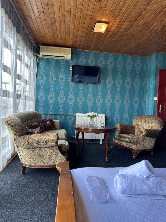 TV a/nebo společenská místnost v ubytování Hotel Odelia