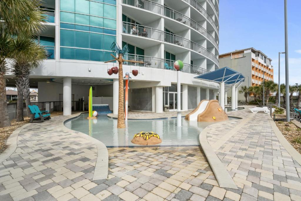 a playground in front of a building at Oceans One Resort Unit 404 - Oceanfront in Myrtle Beach
