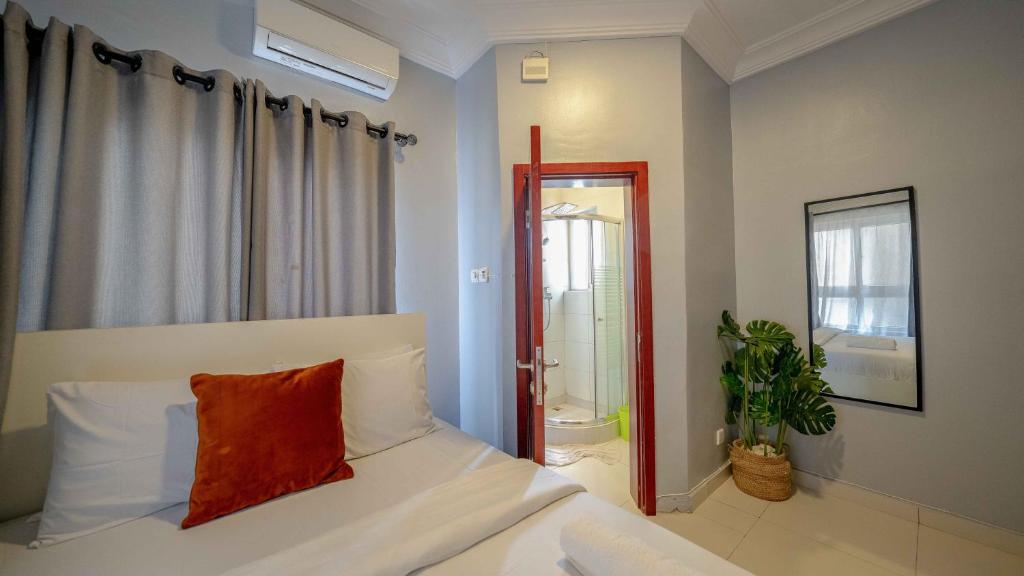 Postel nebo postele na pokoji v ubytování Lekki FootPrint, Lekki Phase1