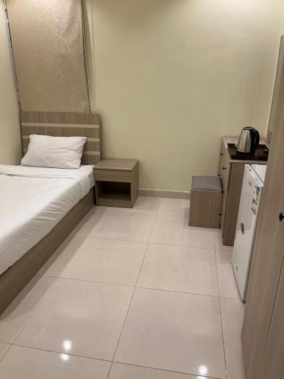 Postel nebo postele na pokoji v ubytování Al tawfeeg hotel - Al Azizyah