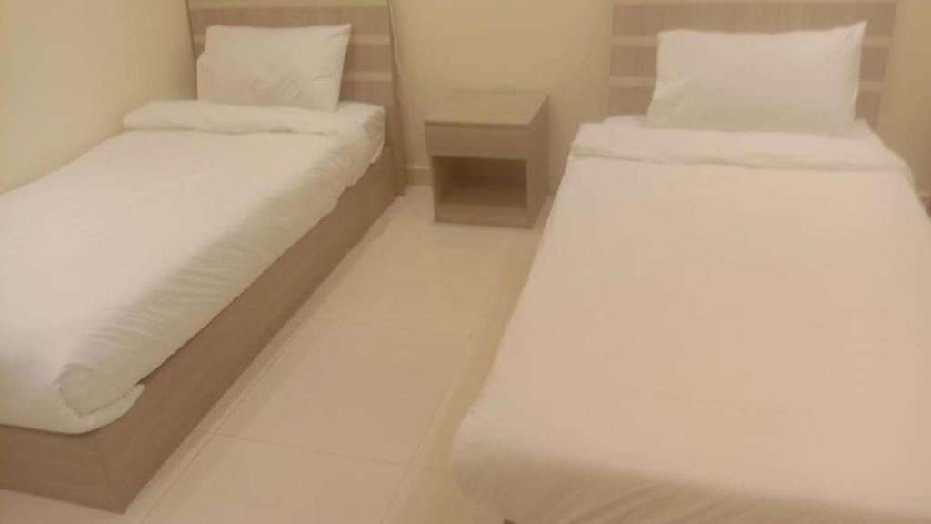 Postel nebo postele na pokoji v ubytování Al tawfeeg hotel - Al Azizyah