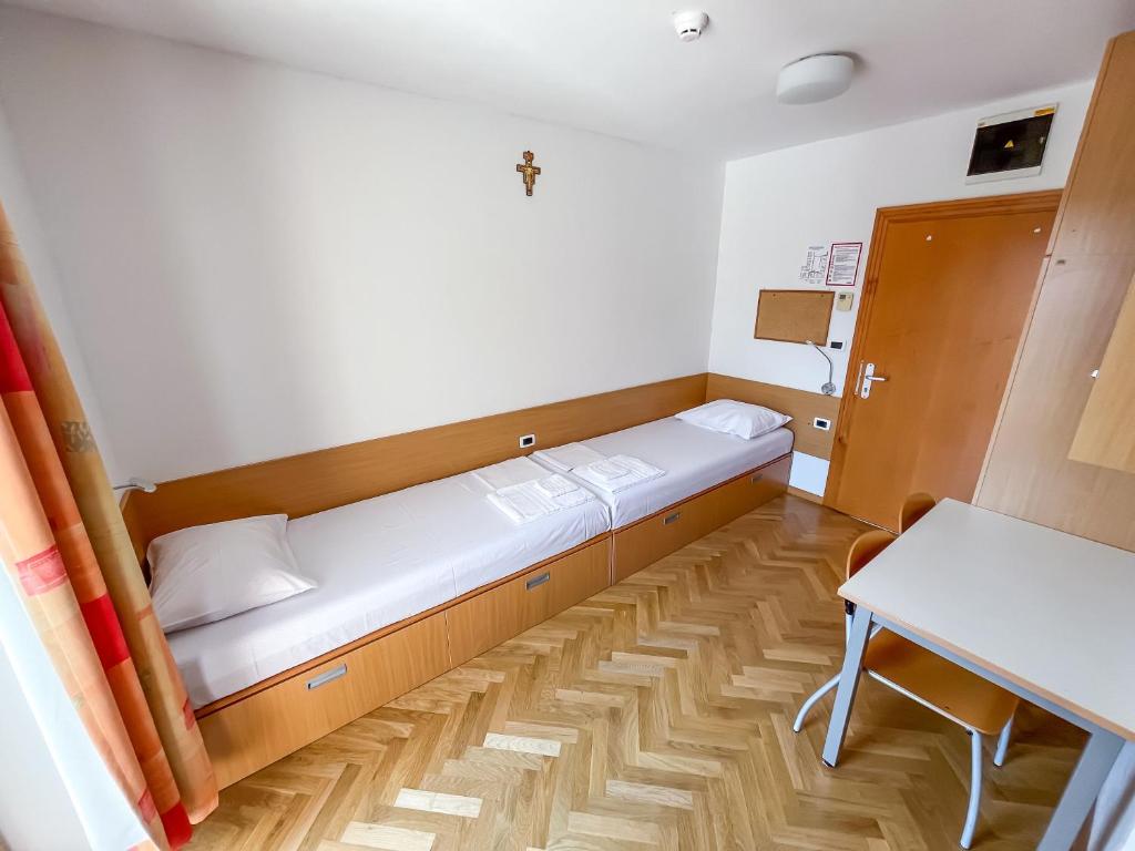 Postel nebo postele na pokoji v ubytování Hostel Sveta Ana