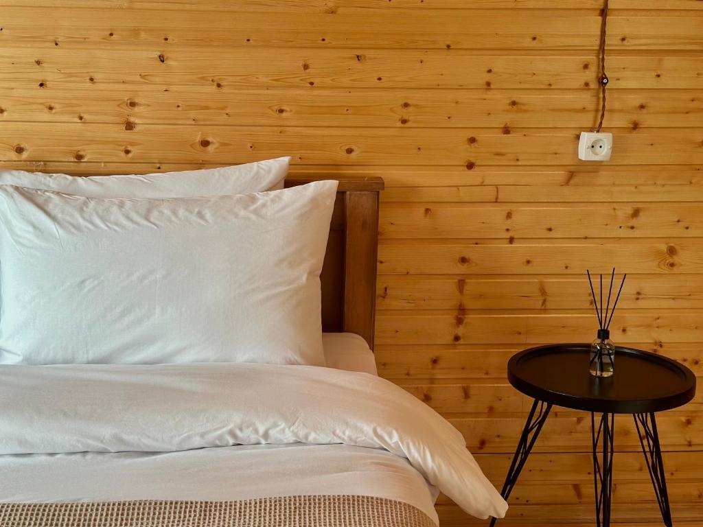 Postel nebo postele na pokoji v ubytování Rakursi
