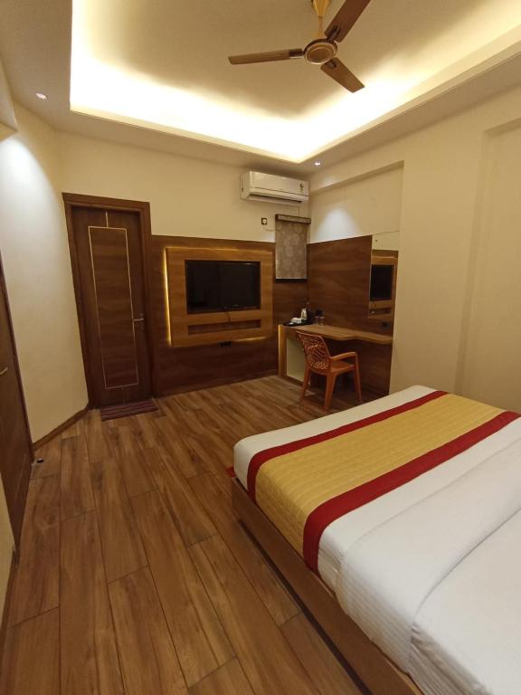 Postel nebo postele na pokoji v ubytování Masaga by Qcent, Gurugram