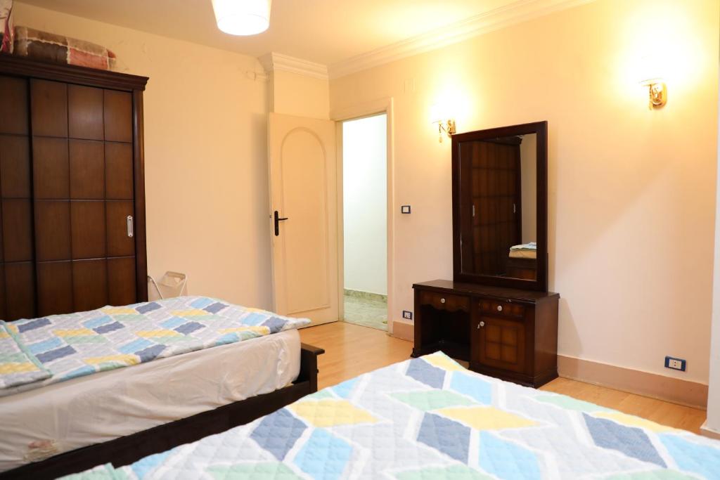 Postel nebo postele na pokoji v ubytování Villa Nasr city