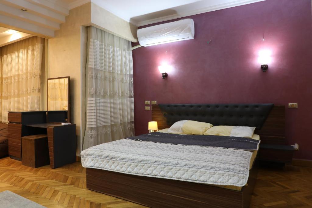 Postel nebo postele na pokoji v ubytování Villa Nasr city