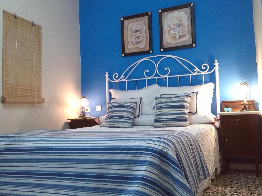 Кровать или кровати в номере Casa Andrea la Abuela