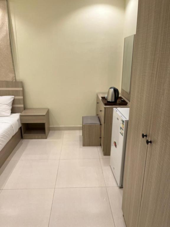 Kuchyň nebo kuchyňský kout v ubytování Al tawfeeg hotel - Al Azizyah