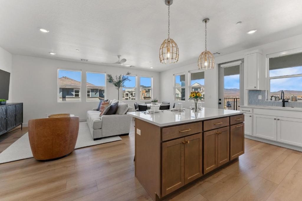 a kitchen and living room with a large island at The Lagoon Neighbor condo in St. George