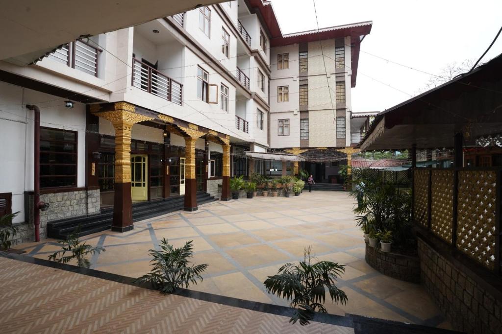 a courtyard of a building with plants in it at Terrace Valley Hotel in Gangtok
