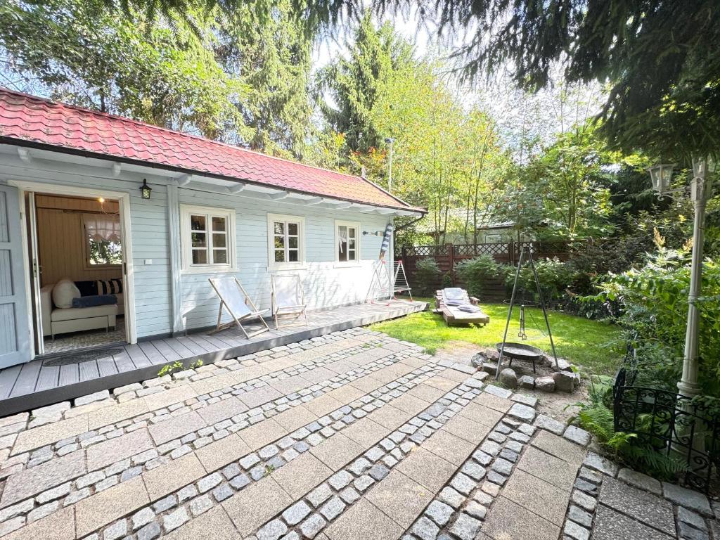Fotografia z galérie ubytovania Tulipanek - domek letniskowy z ogródkiem v destinácii Stegna