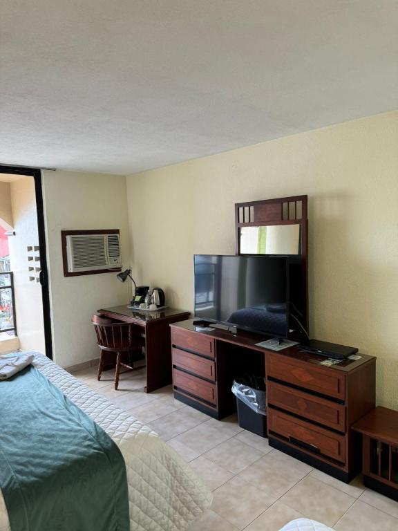 Postel nebo postele na pokoji v ubytování Hotel Bello Cordoba