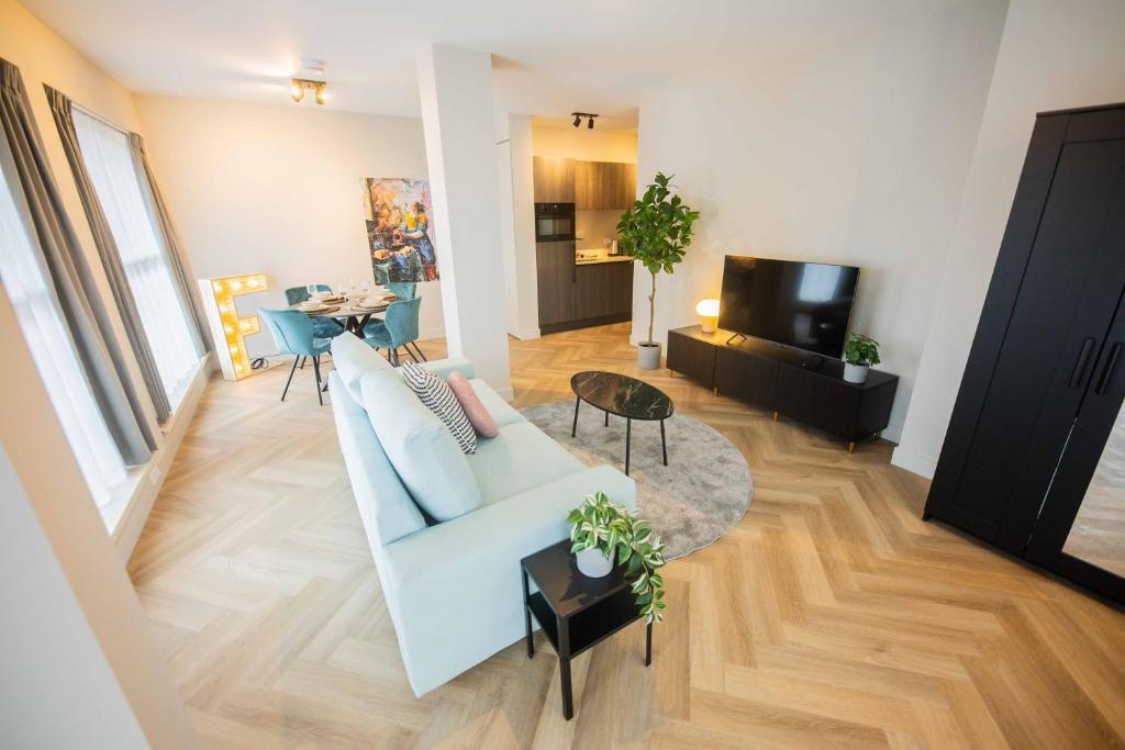 TV a/nebo společenská místnost v ubytování Kerkstraat