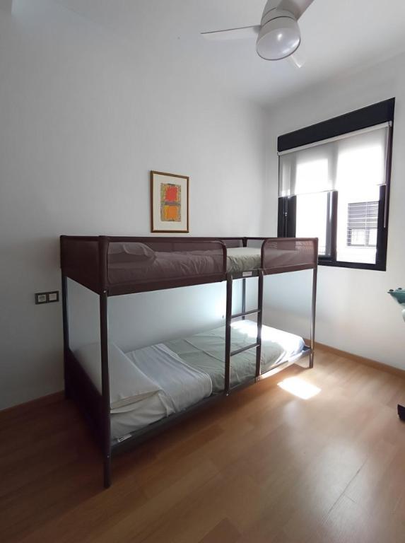 A bed or beds in a room at -MalagaSunApts- Central FreeParking RooftopPool