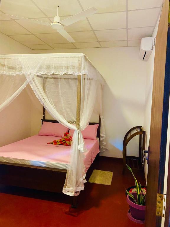 Postel nebo postele na pokoji v ubytování Perfect Home Mirissa