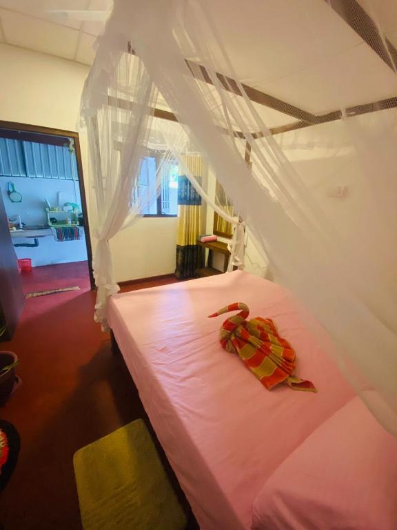 Postel nebo postele na pokoji v ubytování Perfect Home Mirissa