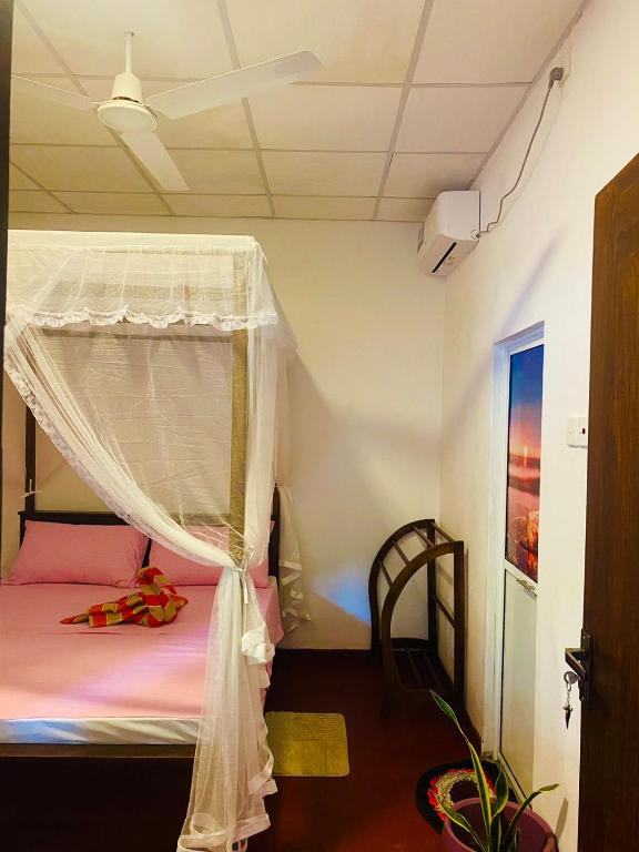 Postel nebo postele na pokoji v ubytování Perfect Home Mirissa