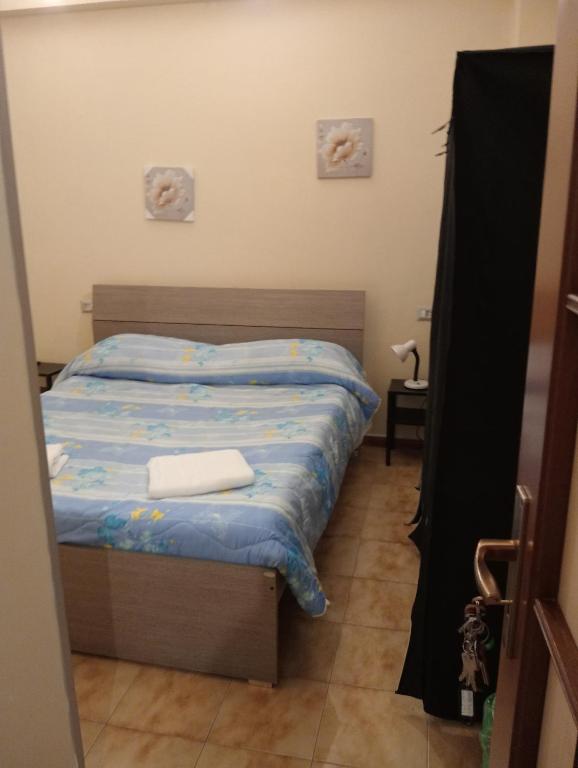Postel nebo postele na pokoji v ubytování B&B Porta Roma