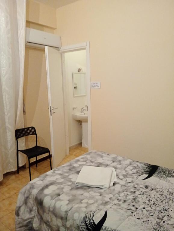 Postel nebo postele na pokoji v ubytování B&B Porta Roma