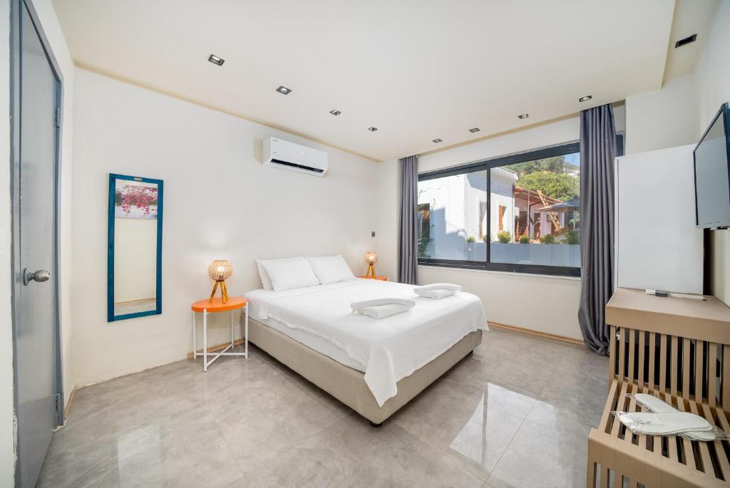 Postel nebo postele na pokoji v ubytování VERA HOTEL KAŞ
