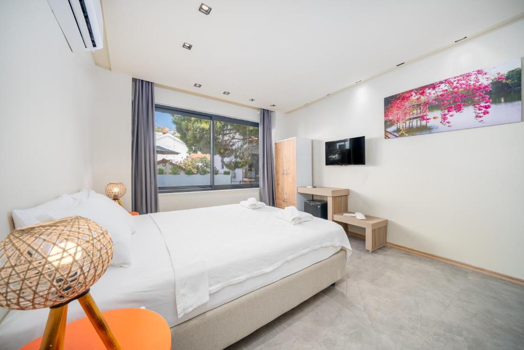 Postel nebo postele na pokoji v ubytování VERA HOTEL KAŞ