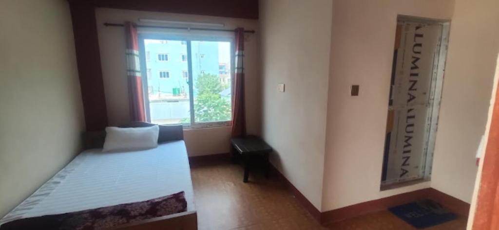 Postel nebo postele na pokoji v ubytování TM Guest House