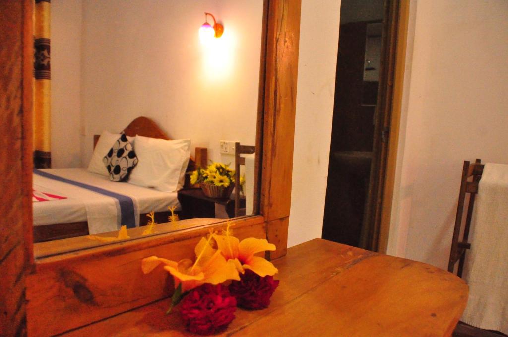 Postel nebo postele na pokoji v ubytování Horizon Resort & Hostel Sigiriya