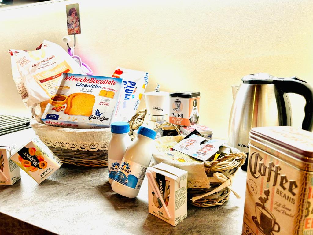 a counter with a bunch of breakfast foods and milk at Ranch Enbrucà in Boves