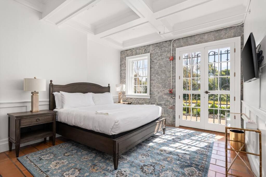 a bedroom with a bed and a window at Stonehouse Inn, Santa Rosa - Private King Suite # 3 in Santa Rosa