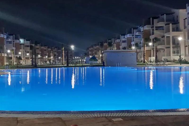 a large swimming pool at night with blue illumination at Mirador Golf 3 cappuccino in Cabo Negro