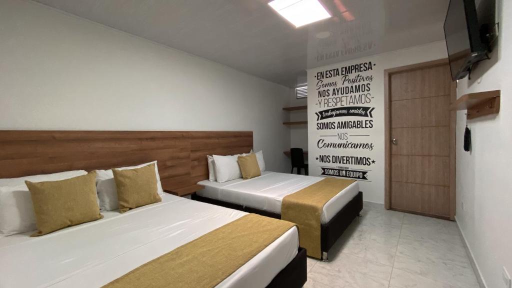Postel nebo postele na pokoji v ubytování Casa Mama Hotel