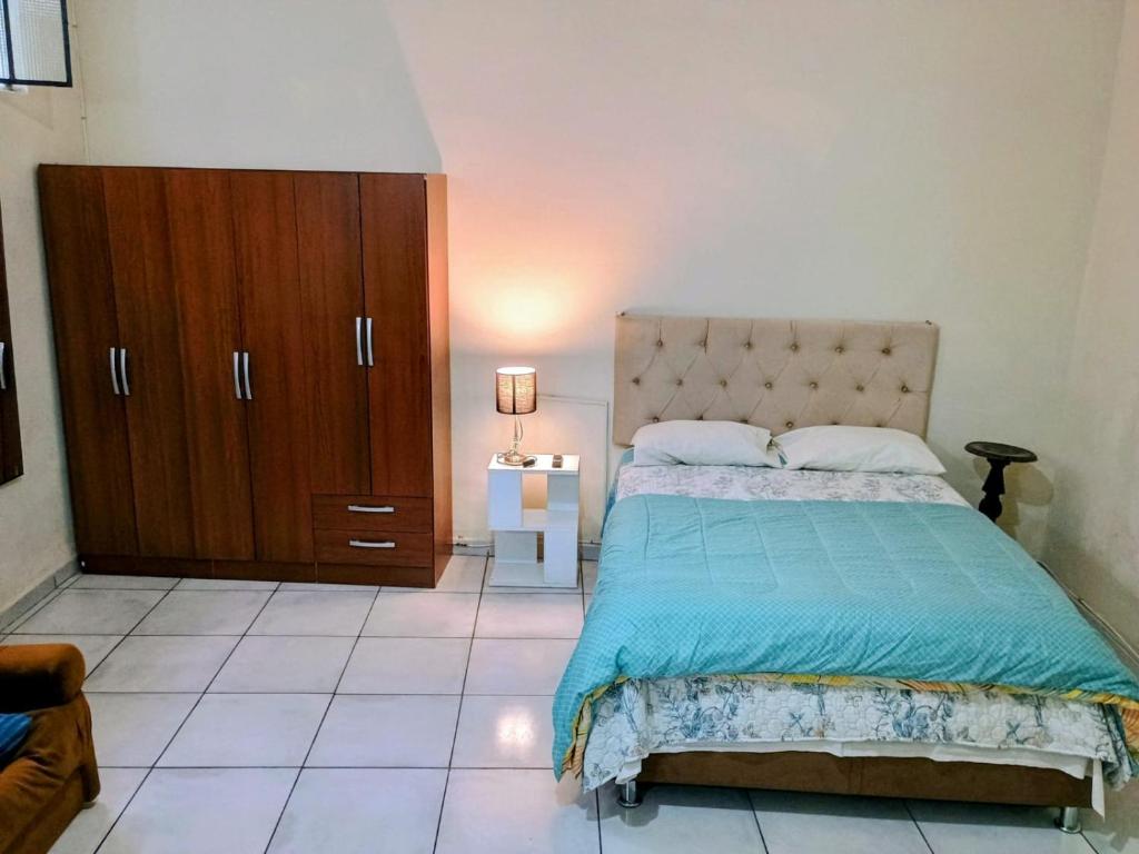 Postel nebo postele na pokoji v ubytování Tacna Guest House