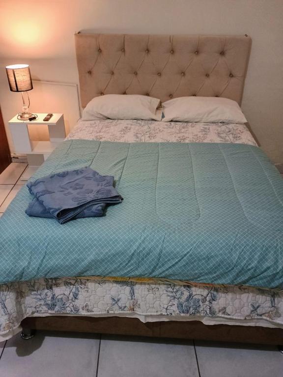 Postel nebo postele na pokoji v ubytování Tacna Guest House