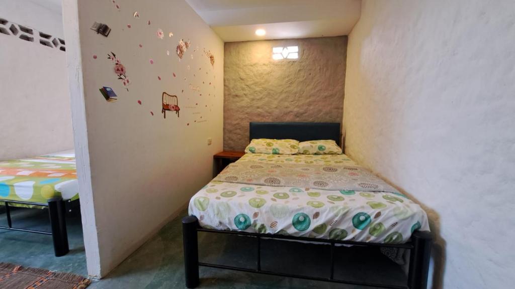 Postel nebo postele na pokoji v ubytování Hostal ROLLED