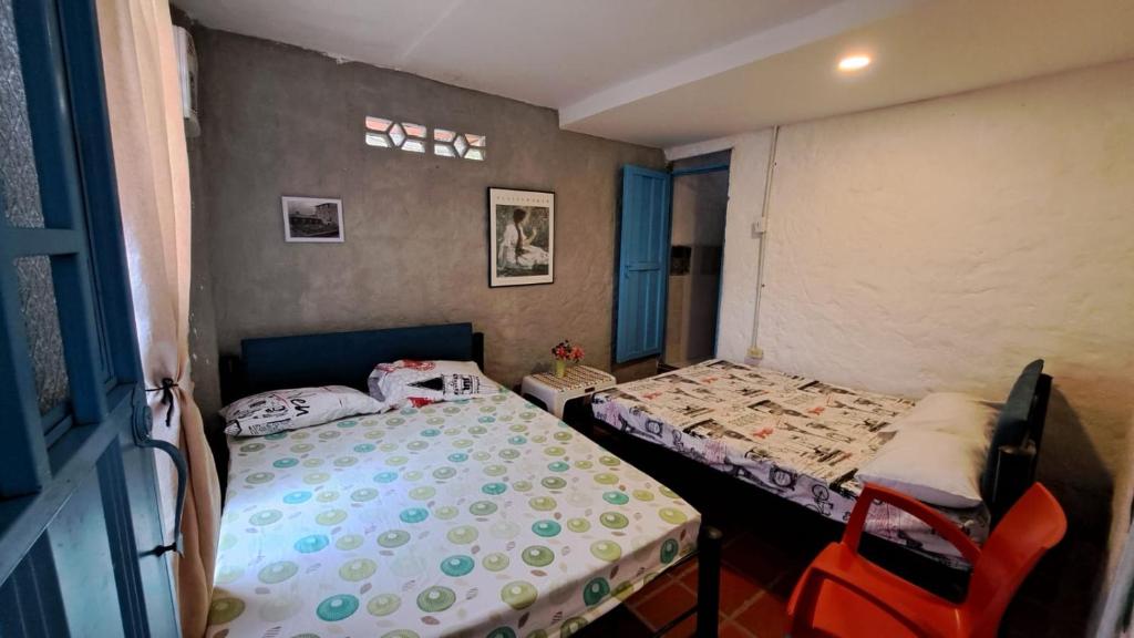 Postel nebo postele na pokoji v ubytování Hostal ROLLED