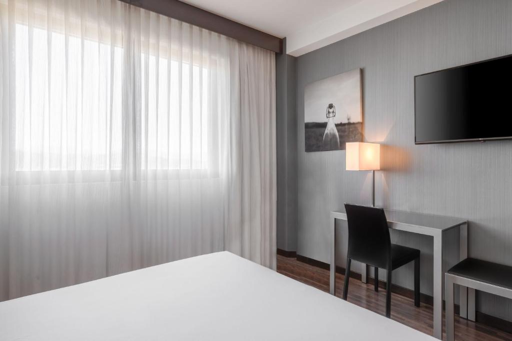 Postel nebo postele na pokoji v ubytování AC Hotel Vicenza by Marriott