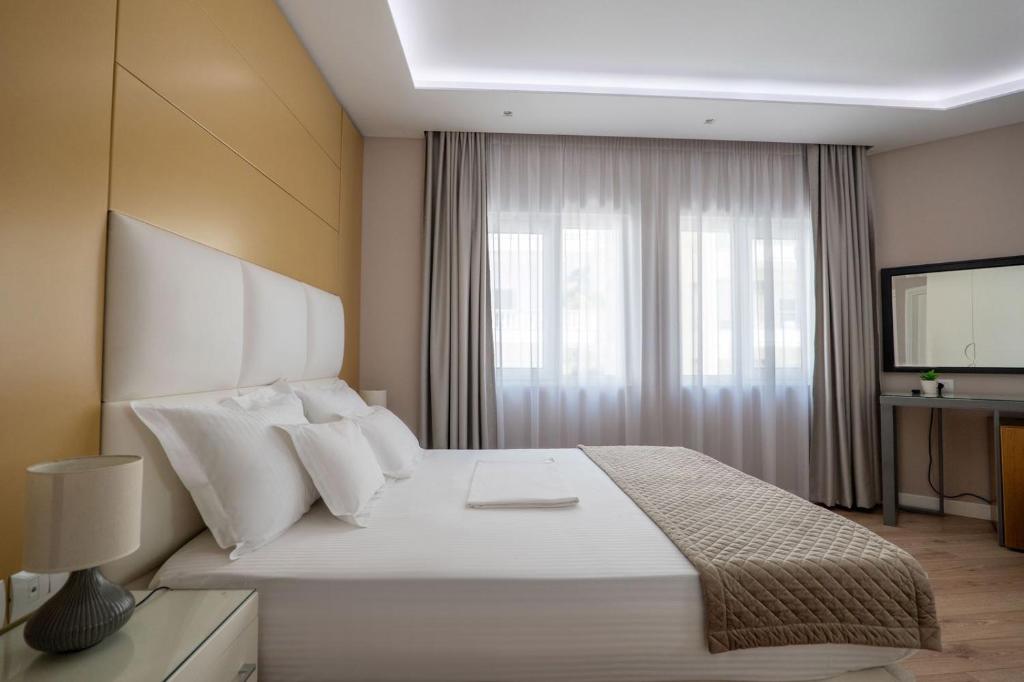 Postel nebo postele na pokoji v ubytování AMI MAR Hotel