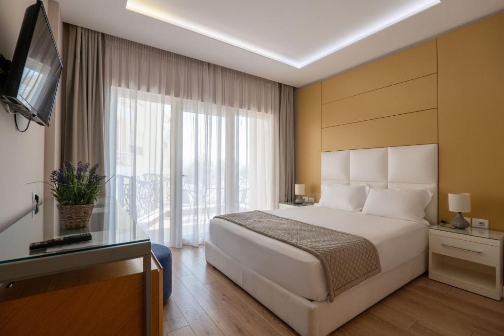 Postel nebo postele na pokoji v ubytování AMI MAR Hotel