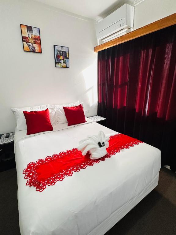 Postel nebo postele na pokoji v ubytování Harrison Motel Papatoetoe