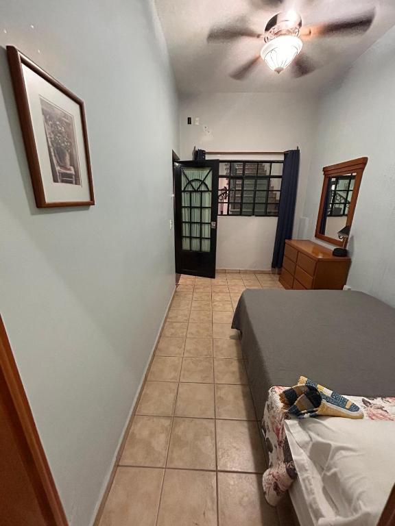 Postel nebo postele na pokoji v ubytování Suites Chingón