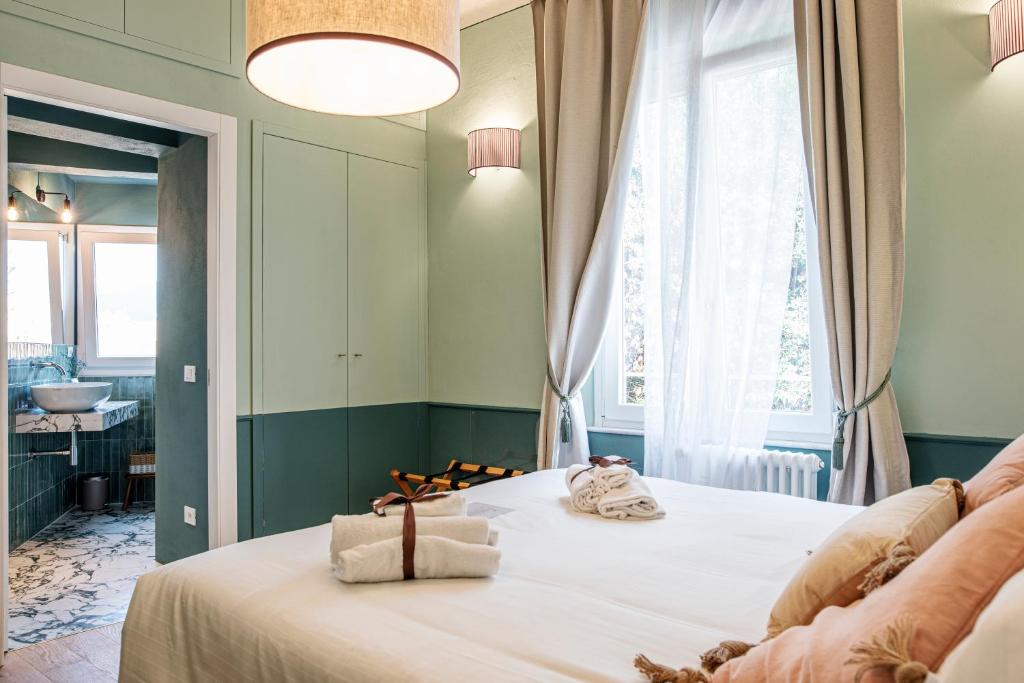 Łóżko lub łóżka w pokoju w obiekcie La Lu cozy rooms 2