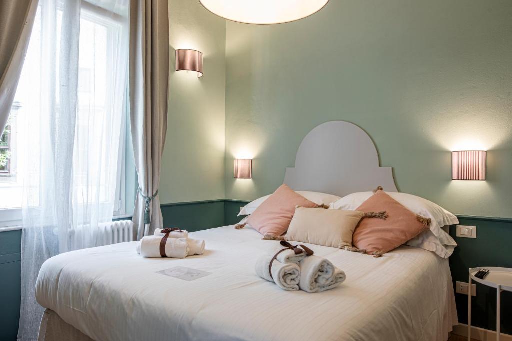 Łóżko lub łóżka w pokoju w obiekcie La Lu cozy rooms 2