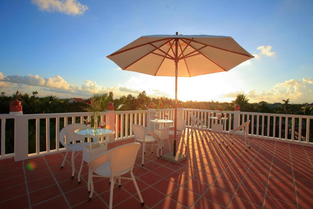 Rõdu või terrass majutusasutuses Coconut Garden Homestay