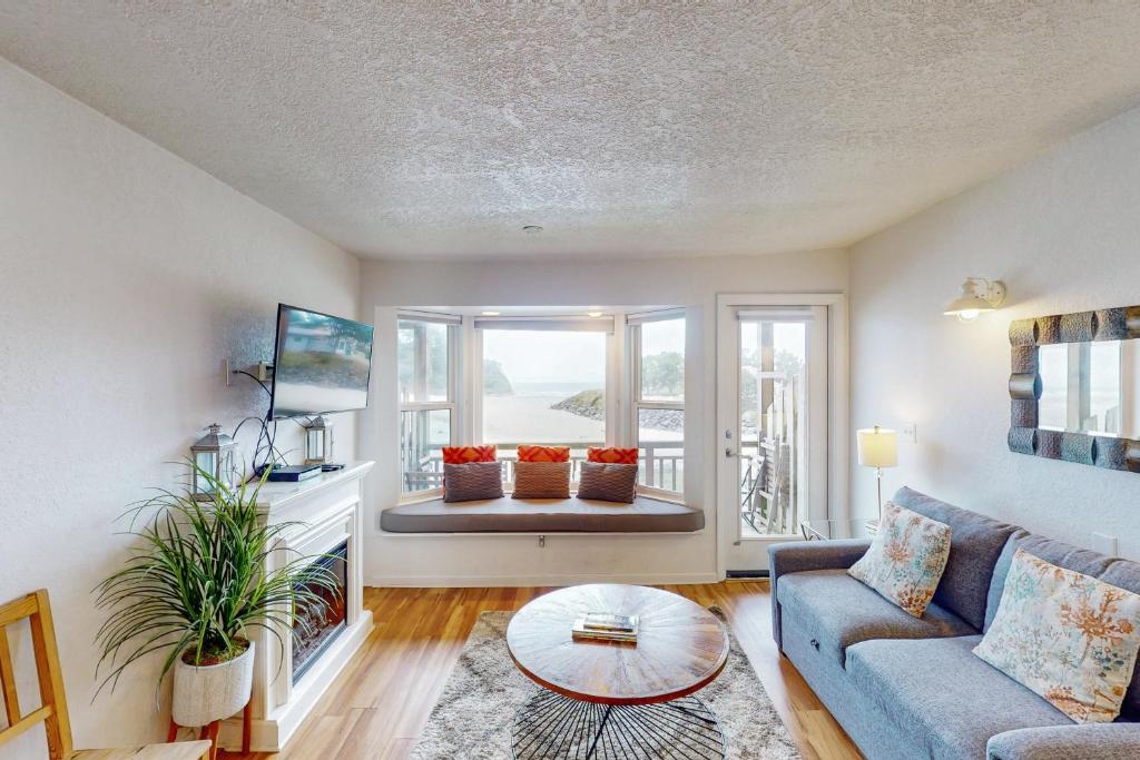 a living room with a couch and a table at Neskowin Ocean Haven in Neskowin