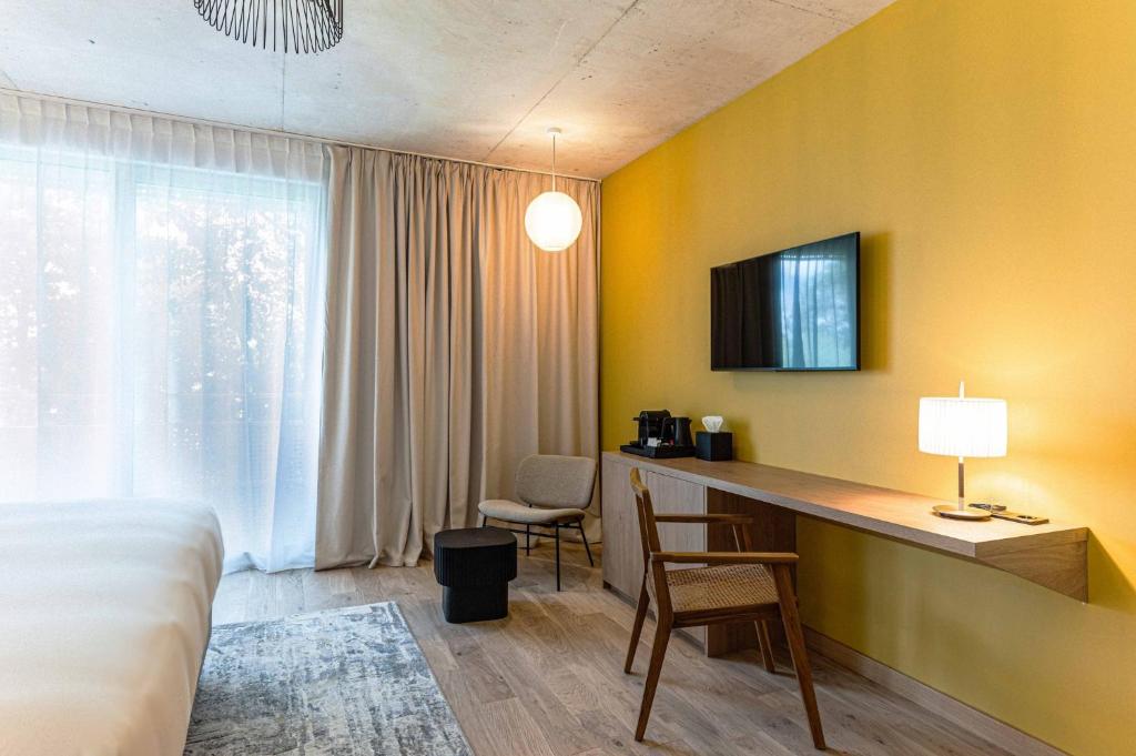 TV a/nebo společenská místnost v ubytování voco Beaune , Cité des Vins by IHG